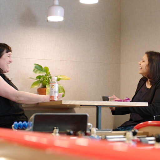 Two women chatting and smiling