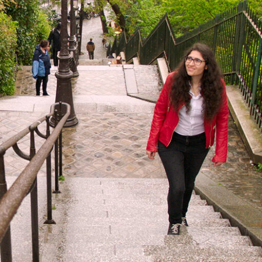 A woman walking up the stairs